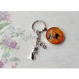 "Elmúlik" üveglencsés kulcstartó