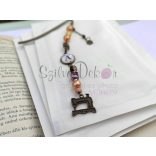 "Varrógép" KönyvÉkszer üveglencsés medállal